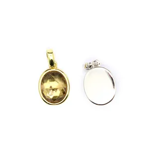 Front and back detail of a faceted oval crystal pendant in a metal bezel