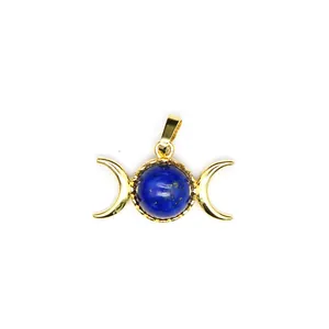 Detailed view of a gold-plated triple moon pendant with a round blue lapis lazuli stone