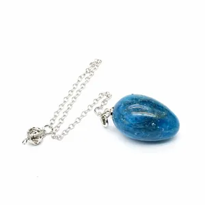 Close-up of blue natural stone egg-shaped dowsing pendulum with silver chain