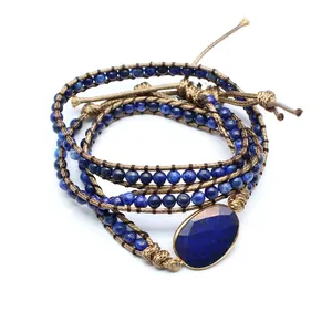 Detailed macro view of a handmade multi-layer blue lapis lazuli beaded wrap bracelet