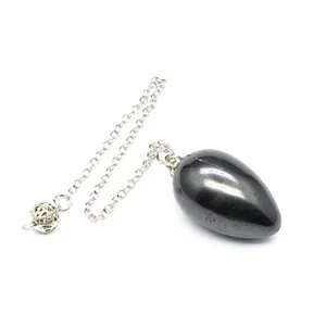 Detailed macro view of a teardrop-shaped natural stone pendulum with silver metal chain.