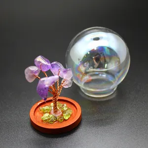 Detailed view of a handmade amethyst crystal tree of life with an iridescent dome