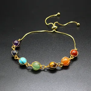 Detail of handmade 7 chakra stone bracelet with adjustable 14K gold filled chain