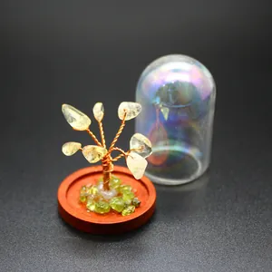 Close-up of crystal tree of life with iridescent glass dust cover for home decor