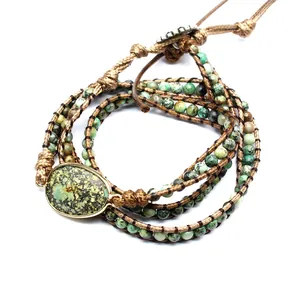 Handmade multi-wrap bracelet featuring green natural stone beads and oval centerpiece