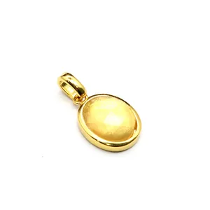 Close-up of elegant oval faceted yellow natural stone pendant in gold setting