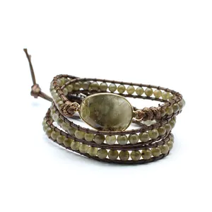 Handmade multi-layer wrap bracelet featuring natural green stone beads and oval center
