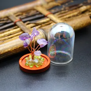 Detail view of mini amethyst crystal tree specimen with glass dome and wooden base