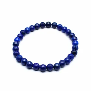 Detailed macro view of a 6mm natural blue stone round bead bracelet for women jewelry