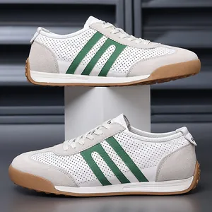 Product detail of white men's sneakers with green stripes and durable gum soles