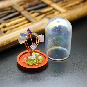 Handcrafted natural gemstone life tree ornament with an iridescent glass display dome
