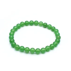 Detailed view of 6mm natural green stone round bead bracelet with smooth finish.