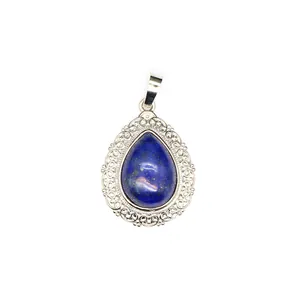 Detailed view of a teardrop lapis lazuli pendant with intricate silver filigree frame