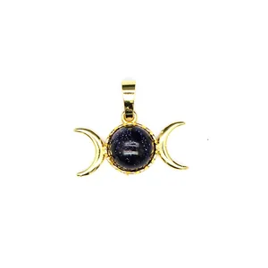Detailed macro view of a gold-plated triple moon pendant with sparkling blue goldstone