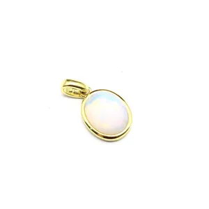Close-up detail showing the faceted cut of the oval Amazonite stone in a gold pendant