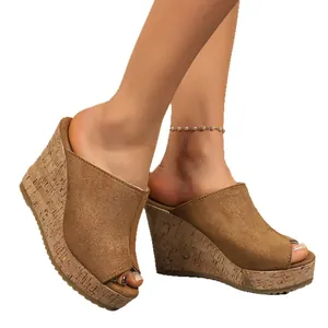 Stylish women's brown suede peep-toe wedge sandals with a high cork platform sole