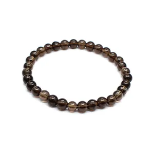 Detailed macro view of a 6mm smoky brown natural stone beaded bracelet for women
