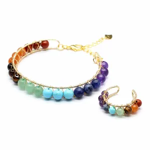 Detail view of handmade 14K gold-filled chakra bracelet and matching ear cuff set