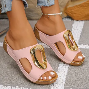 Detailed view of pink wedge sandals for women featuring stylish gold metal buckle and platform soles