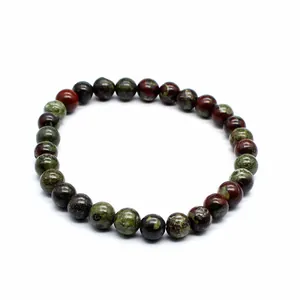 Detail view of 6mm dragon blood stone round bead bracelet on white background