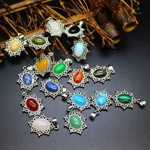 Macro view showing various natural stone pendants in filigree silver-tone settings.