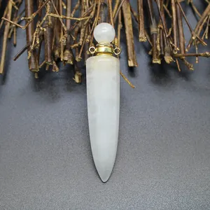 Detail view of a hexagonal cone-shaped natural white stone perfume bottle pendant.