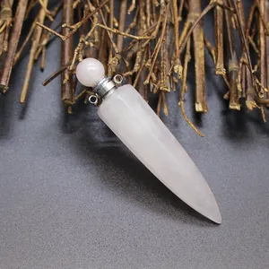 Detailed macro view of a hexagonal rose quartz aromatherapy bottle pendant with natural wood accents