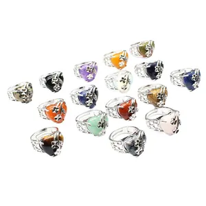 Assorted adjustable heart-shaped natural stone rings featuring floral silver-tone bands
