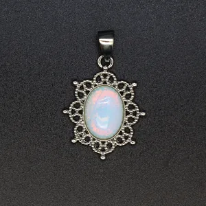 Vintage style silver hollow filigree pendant with oval white opalescent stone for necklace