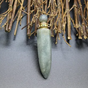 Detail shot of hexagonal natural stone perfume bottle pendant with gold screw cap