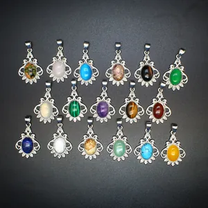 Variety of natural stone pendants with vintage silver frames displayed on black background
