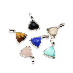 Detailed view of faceted triangular natural stone pendants in assorted vibrant colors
