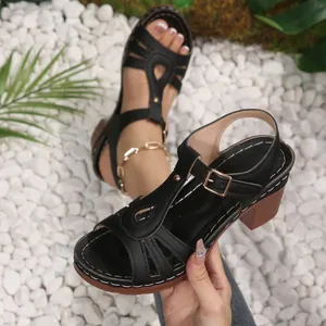 Elegant women's black chunky heel sandals with T-strap and peep toe design for summer