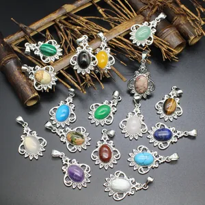 Collection of oval natural stone pendants with vintage silver-tone floral frames.