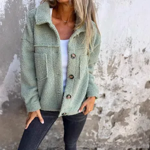 Close-up of a cozy women's green teddy fleece jacket with button details and lapels