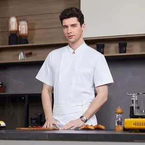 Professional white short sleeve chef jacket for men in a modern kitchen setting