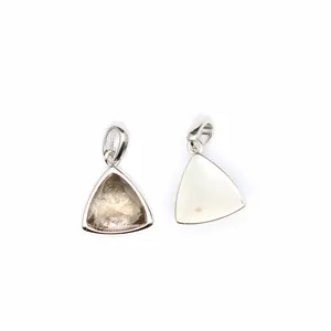Detailed view of two triangle faceted natural stone pendants with silver metal frames.