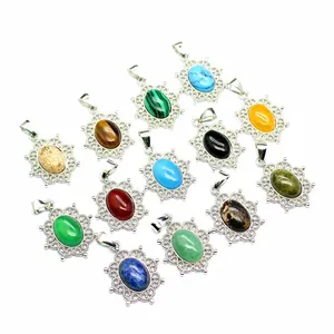 Detailed view of varied natural stone pendants with intricate silver filigree borders
