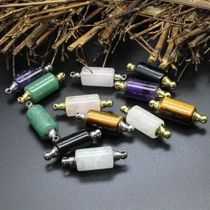 Macro detail of cylindrical natural stone essential oil bottle pendants in various colors