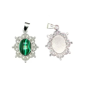 Detailed macro view showing front and back of green malachite style stone openwork pendant