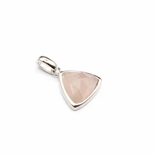 Close-up detail of a triangular faceted rose quartz pendant in silver setting