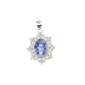 Detailed macro view of a vintage filigree silver pendant with oval blue point stone