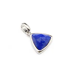 Detailed view of faceted natural blue lapis lazuli triangle pendant in silver setting
