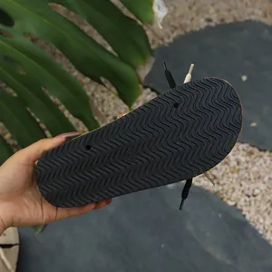 Macro detail of wavy non-slip rubber sole on thick-sole clog sandals, showing size 38.