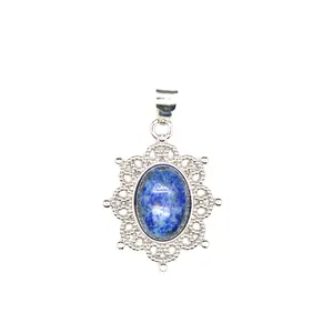 Macro view of a natural blue stone pendant necklace with intricate silver hollow lace detail