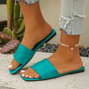 Elegant turquoise square toe flat slide sandals with a wide pleated strap for summer
