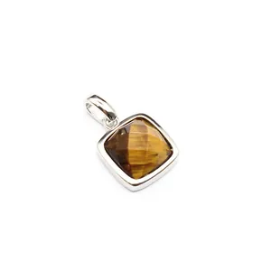 Detailed macro view of a square faceted natural tiger eye stone pendant in silver.