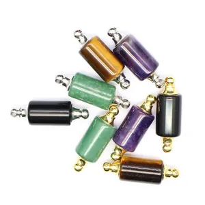 Macro view of assorted natural stone essential oil bottle pendants with metal caps.