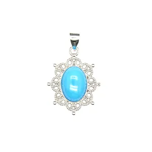 Vintage style intricate silver filigree pendant with an oval light blue gemstone