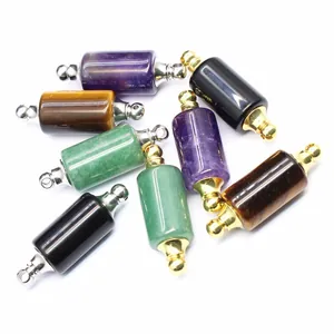 Macro detail of cylindrical natural stone essential oil bottle pendants in multi colors